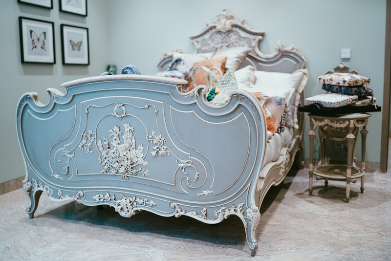 kleo-pillowsnight | White pillows on a bed next to a nightstand